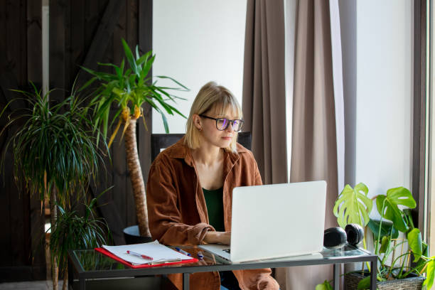 istock Middle age woman woking with laptop computer at home 1779777072