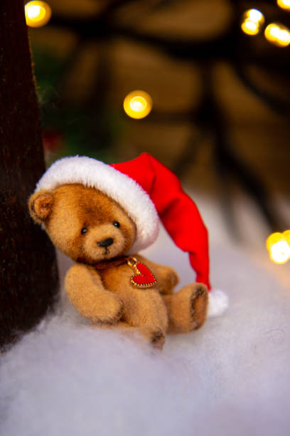 istock Cute hand made toy bear with Christmas Santa hat 1779781497