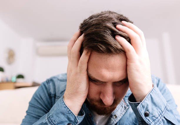 istock Distraught Man, Hands on Head, Expressing Desperation and Sadness 1779786097