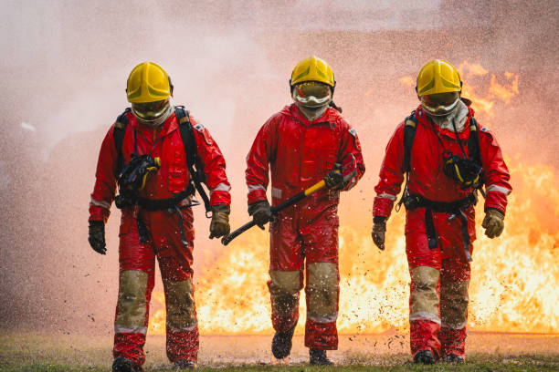 istock photo of three firefighters walking confidently back after extinguishing a fire 1779793148
