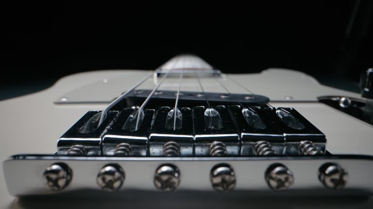 White legendary electric guitar design.Music background. Slider extremely macro