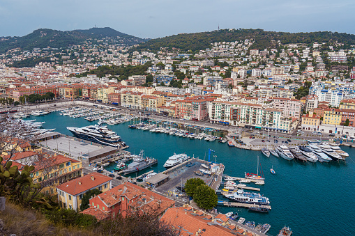 Yachts in bay near houses and hotels, La Condamine, Monte-Carlo, Monaco, Cote d'Azur, French Riviera.