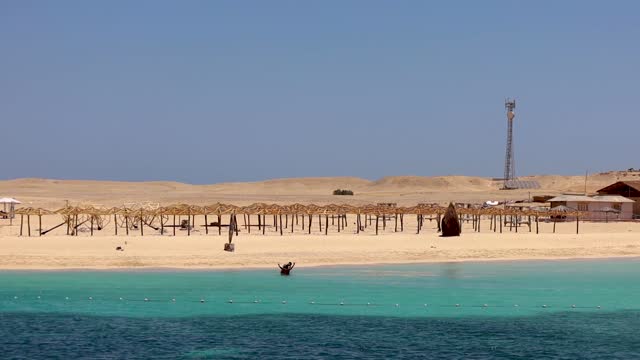 Idyllic island, sandy beach and crystal clear Red Sea