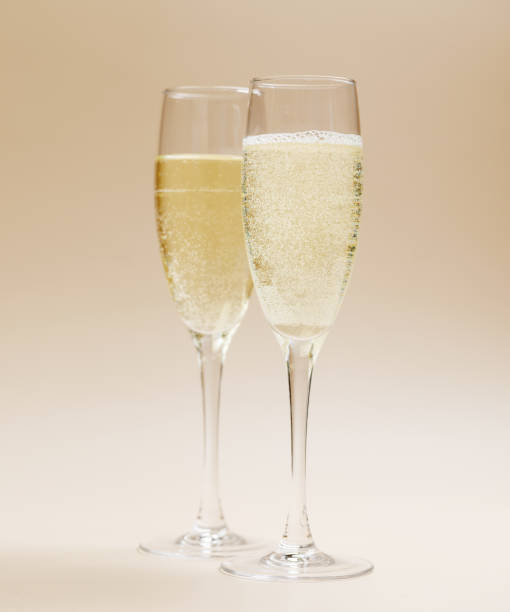 istock Two champagne glasses on a beige 1779829208
