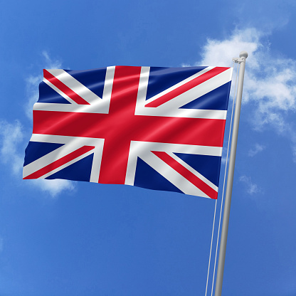 3d illustration flag of United Kingdom. United Kingdom flag isolated on the blue sky with clipping path.