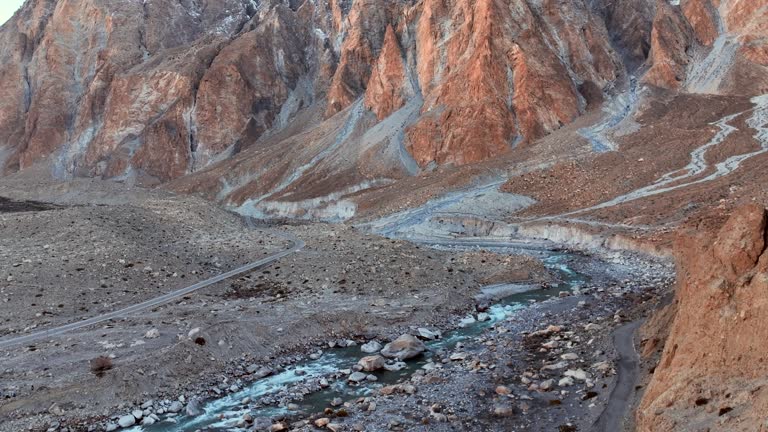 Aerial view Sunrise scene Passu Mountain Range and hunza river in Karakoram Range in Himalayas mountains along Karakoram Highway in Spring. Northern Pakistan