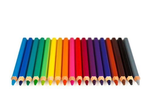 set of multi-colored pencils on a white background close-up