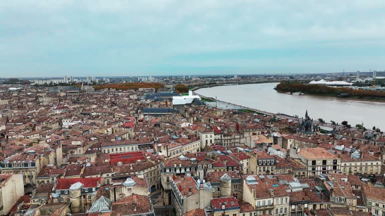 Aerial view of Bordeaux downtown along the Garonne River at sunset, France.