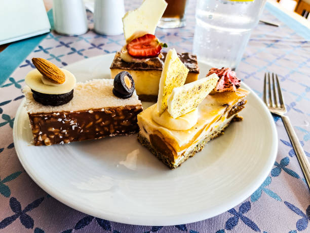 istock A plate with cakes and dessert tarts stands on a table 1779853476