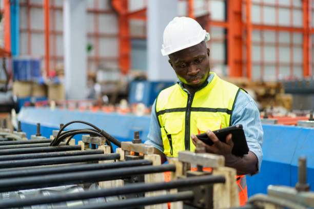 istock Engineer inspecting machines in factory. 1779869869