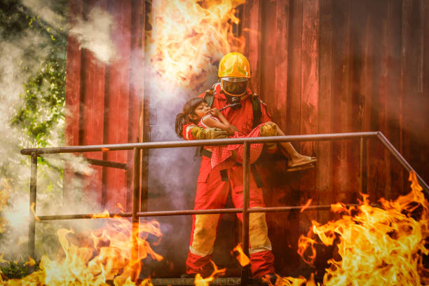 istock Firefighters bravely help fire victims out of the fire 1779874365