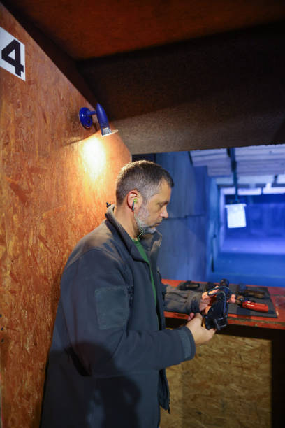 istock Man choose the pistol at firing range 1779902506