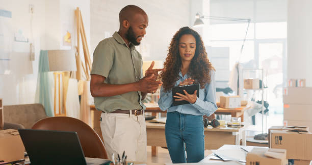 istock Teamwork, business staff and working on tablet planning, collaboration or online shop order. Sale info, employees and manager consulting with employee on research, ecommerce and store data analysis 1779902530