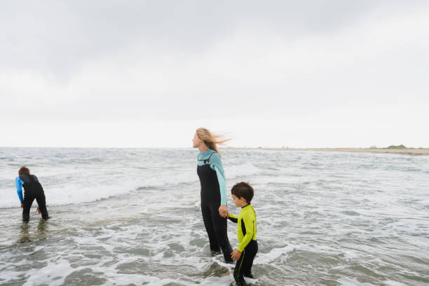 istock Gloomy day on the beach with my boys 1779907037