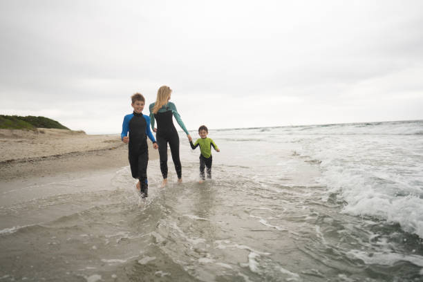 istock Gloomy day on the beach with my boys 1779910433