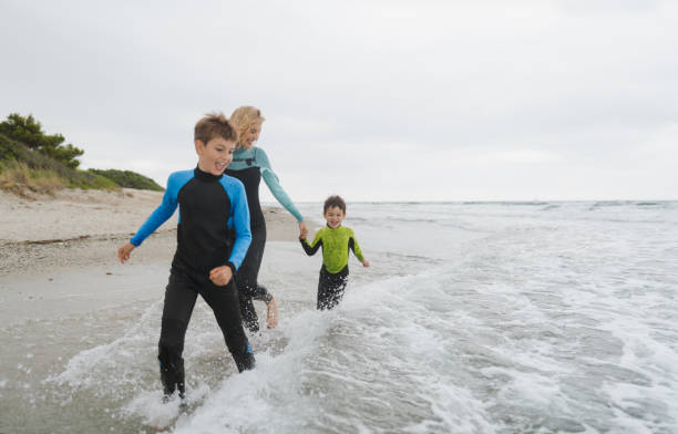 istock Gloomy day on the beach with my boys 1779910973