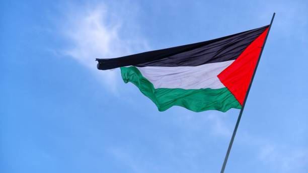 istock Palestine flag waving beautifully with blue sky background 1779926581