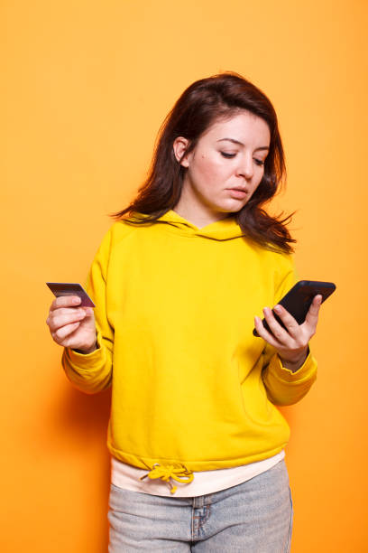 istock Woman using smartphone to shop online 1779930967