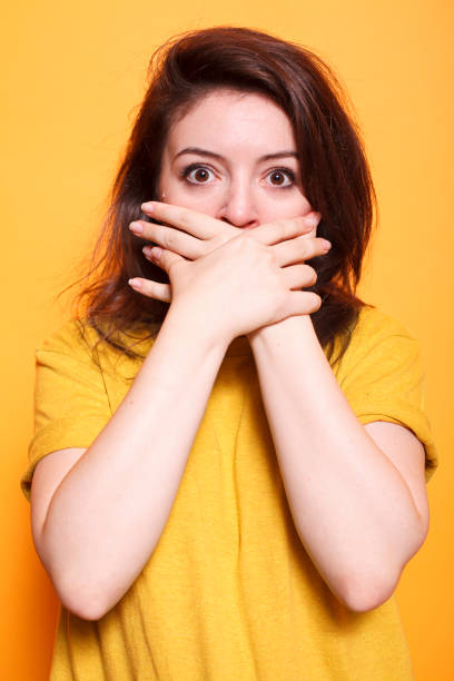 istock Shocked woman with her mouth covered 1779937149