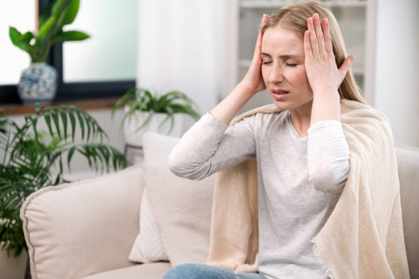 istock stressed woman feeling acute headache and suffering from migraine 1779938786