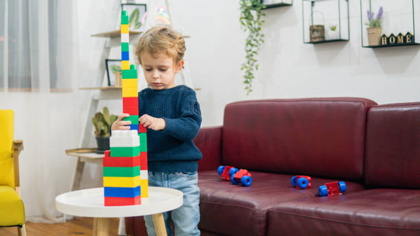 istock Child playing with colorful toy blocks. 1779946685