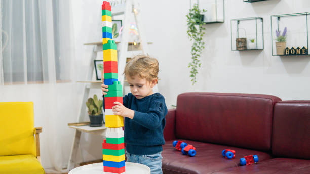 istock Child playing with colorful toy blocks. 1779948926