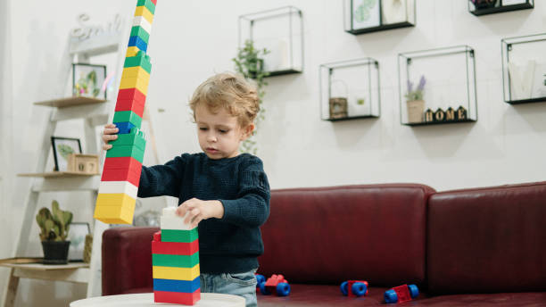 istock Child playing with colorful toy blocks. 1779951799