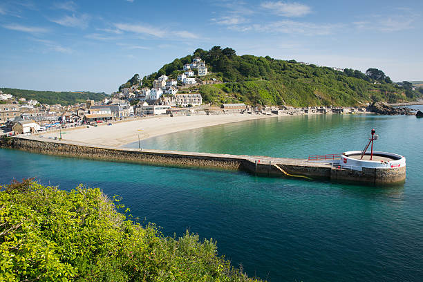 Looe harbour Cornwall England with blue sea stock photo