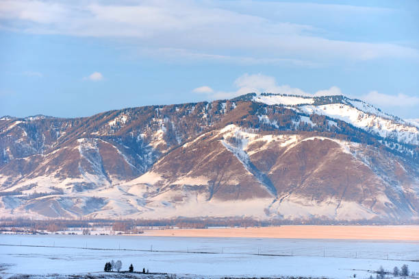 istock Cold snowy mountain landscape at sunset. 1779966764