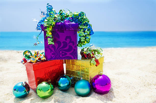 istock Gift boxes with Christmas balls on the beach 177997116