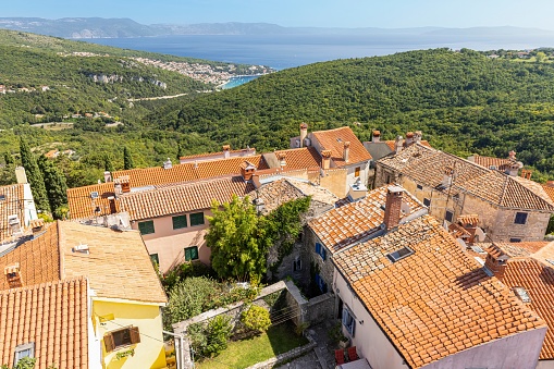 View from the historic town of Labin in Istria to the Croatian seaside resort of Rabac during the day in summer