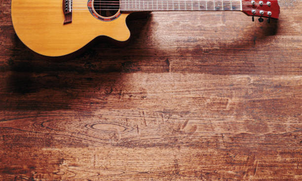 istock classical guitar on wooden background 1779984870