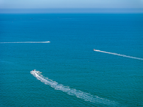 Islands and speedboat in blue sea