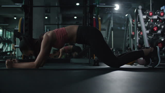 Woman pose plank with body saw for build muscle