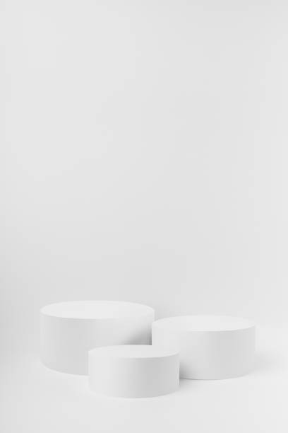istock Abstract three white round podiums for cosmetic products as mockup on white background. Scene for presentation products, gifts, goods, advertising, design, sale, text, display, showing. 1780051051