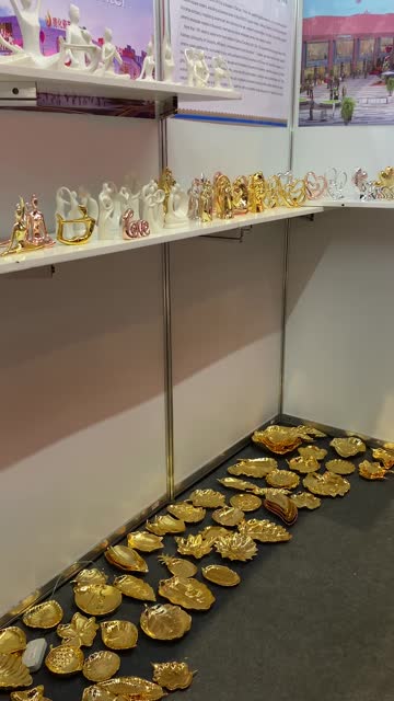 Various Chinese pottery, platter and figurines at the store exhibition. Vertical