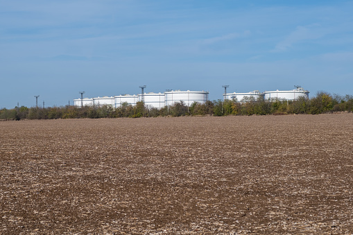 bio power plant with storage of wooden fuel (biomass) against blue sky