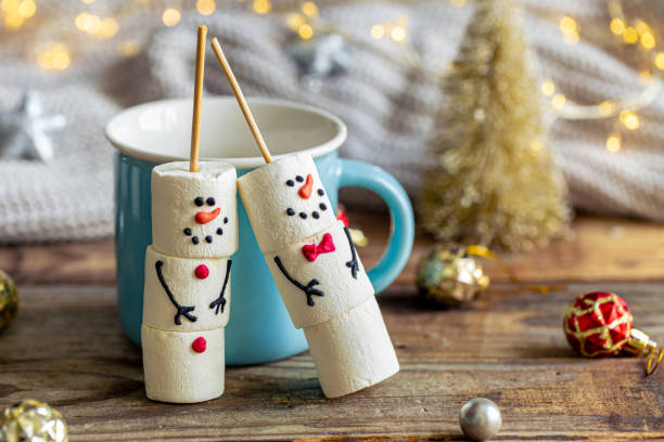 istock Hot chocolate mug and snowmen made of marshmallows. 1780064659