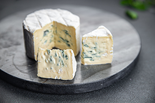 creamy blue cheese with intense flavor soft mold cheese delicious healthy eating cooking appetizer meal food snack on the table copy space food background rustic top view