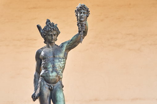 Bronze statue of Perseus with the head of Medusa, masterpiece by Benvenuto Cellini in Florence, empty space on the right