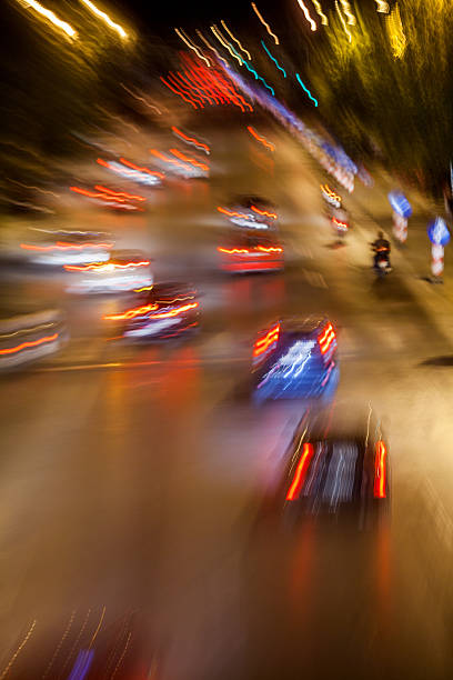 istock Cars in motion at night 178008860