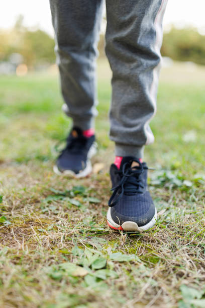 istock Little Girl Walking on Grass 1780091435