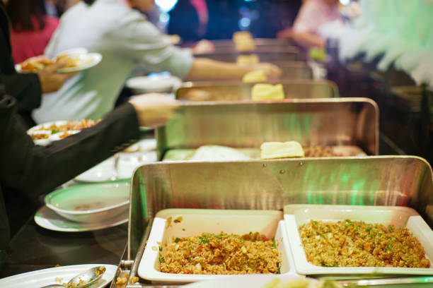 People group grab buffet food in restaurant after seminar