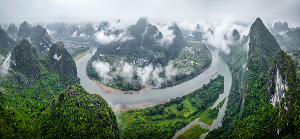 Clouds, fog in a misty morning on karst mountains and river Li in Guilin/Guangxi region of China from Xianggongshan Scenic Spot