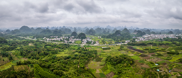 Panoramic aerial view of huixian town between karst mountains in yangshuo county, guilin, Guanxi region, china