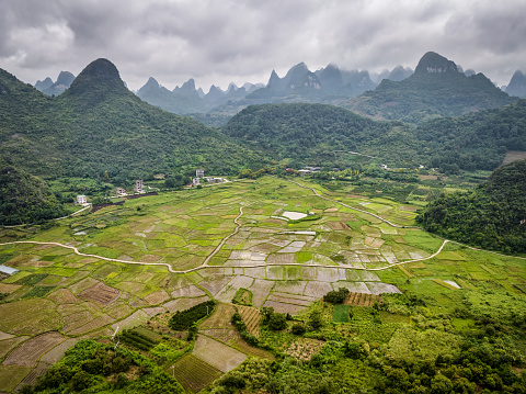 Aerial view of rice fields between karst mountains in huixian town, yangshuo, guilin, china