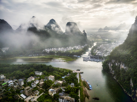 Aerial view of Xingping Ancient Town and Li Jiang river in a cloudy morning. Yangshuo county, Guilin, Guangxi province, China