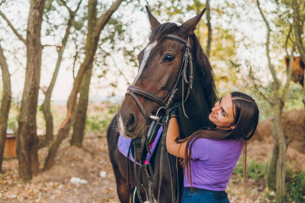 istock Young woman enjoys with her horse 1780124022
