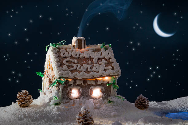 istock Snowy gingerbread cottage at night in winter 178013103