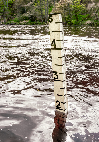 Close-up of a gauge measuring a high water level at the River Spey in Scotland.